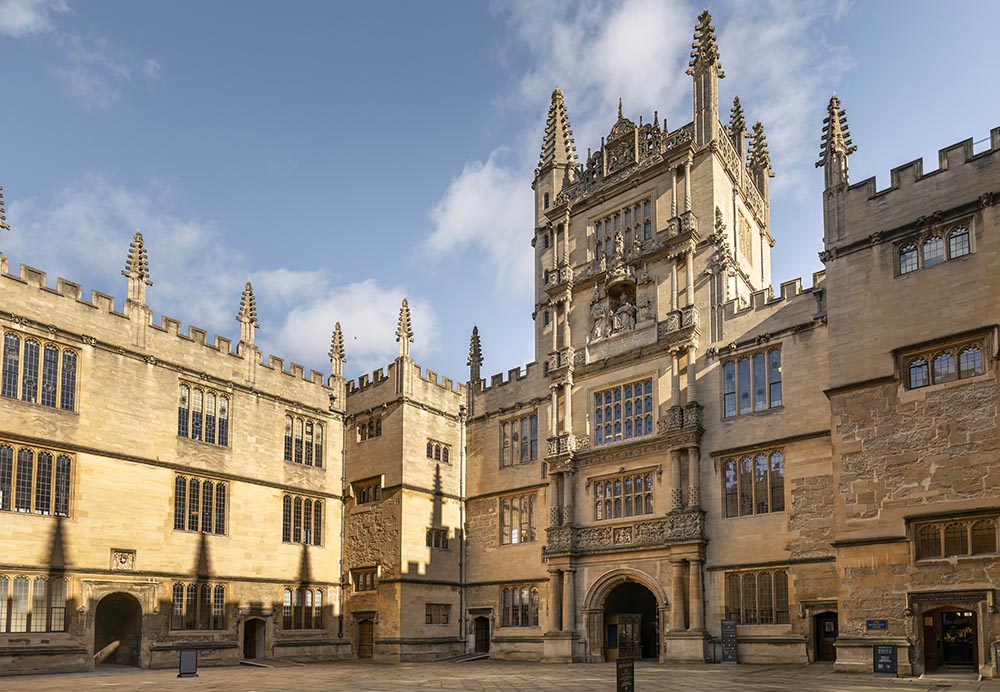 Old Schools Quadrangle A large stone courtyard surrounded by tall stone buildings with a tower