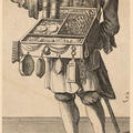 A man stands with a sales box around his neck. The box has compartments with different items for sale